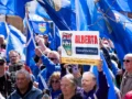 Supporters of Alberta independence rallying with placards