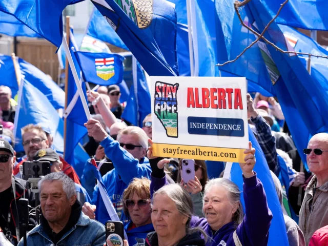 Supporters of Alberta independence rallying with placards