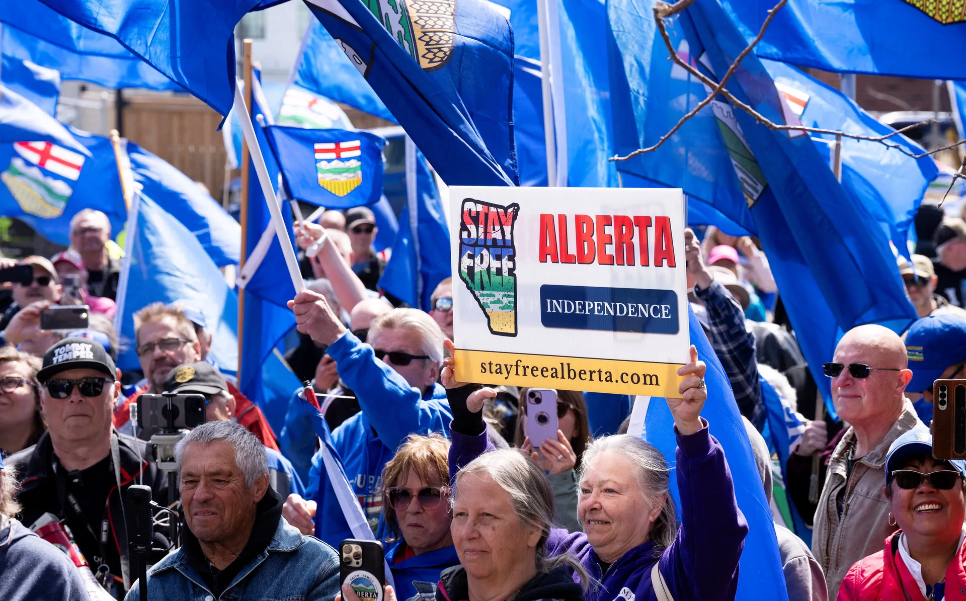 Supporters of Alberta independence rallying with placards