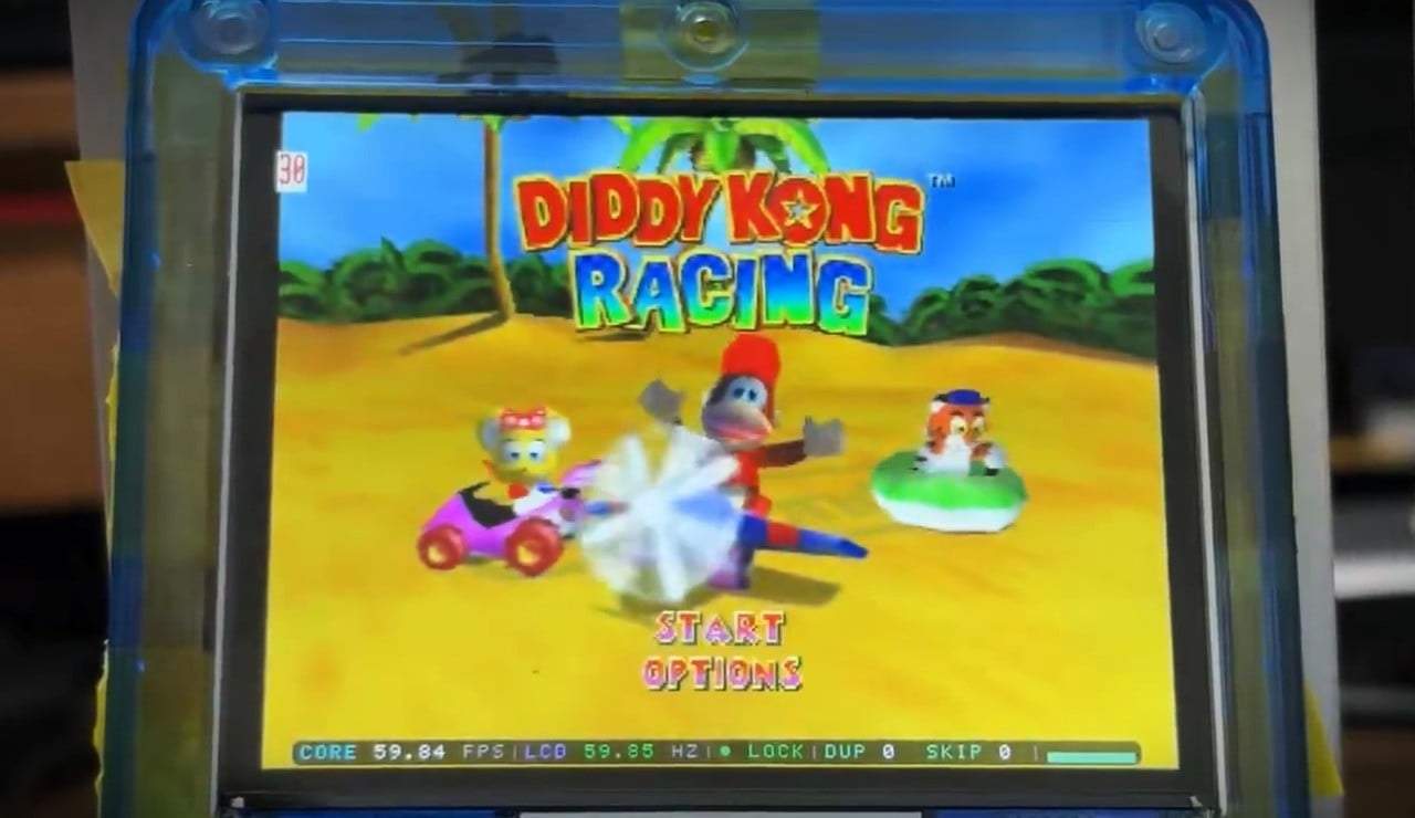 Taki Udon's transparent-blue FPGBA SP prototype screen running Diddy Kong Racing (N64) as a power demonstration.