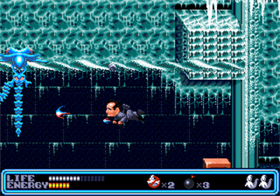 A Ghostbuster firing a proton stream at a blue ghost in Ghostbusters: Special Edition for Sega Genesis