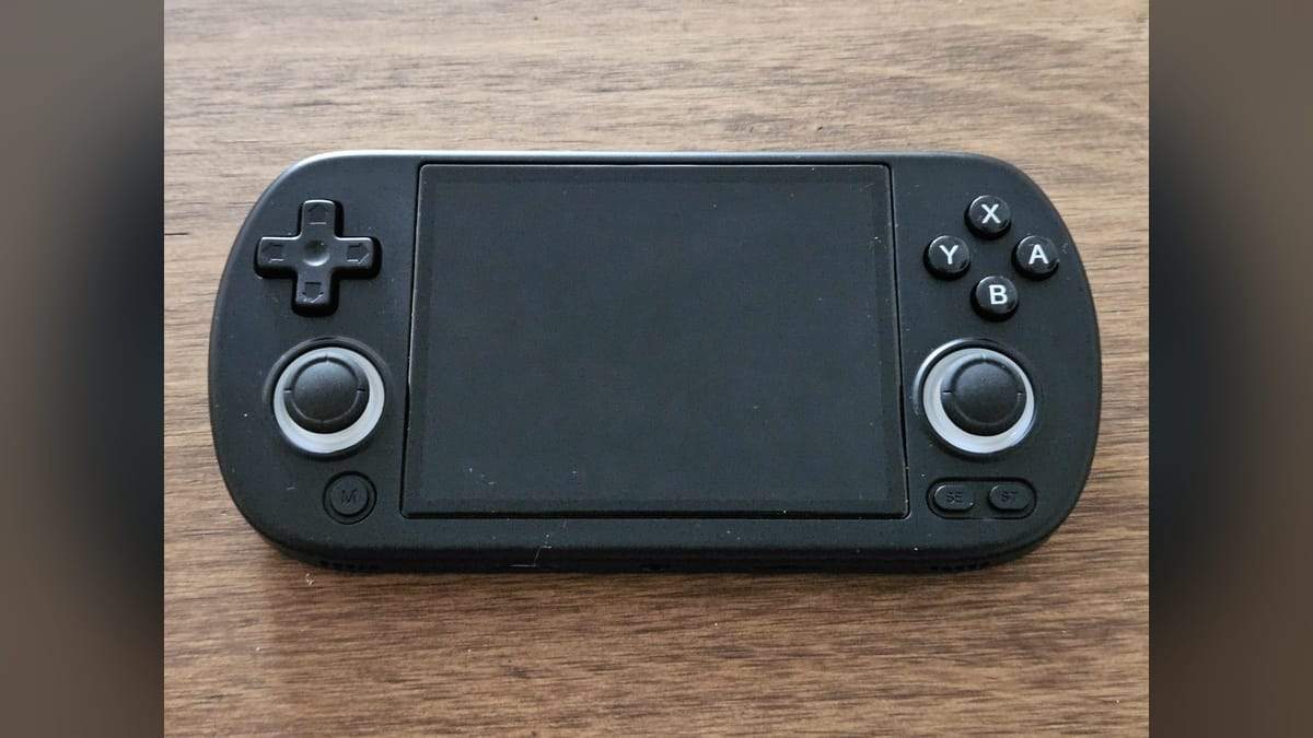 A black budget retro handheld with twin analog sticks and ABXY buttons