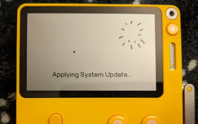 A yellow Playdate handheld displaying the Questy Chess game on its screen
