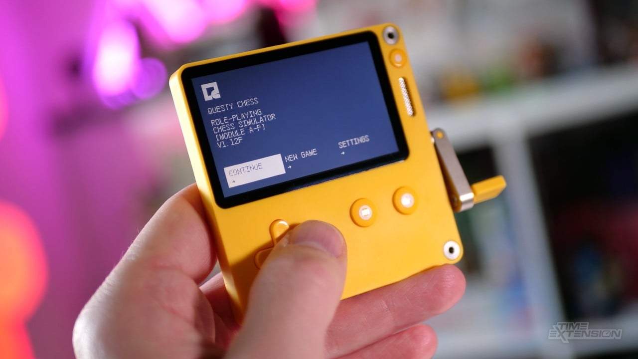 A Playdate displaying the 'Applying System Update' screen during a firmware update